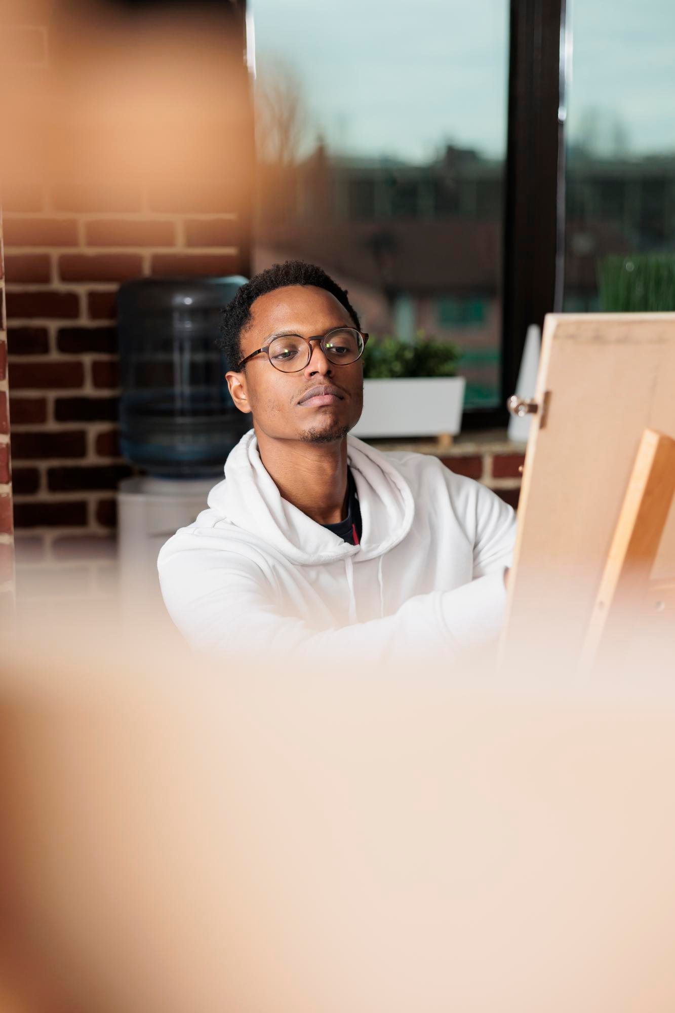 http://img.b2bpic.net/free-photo/inspired-african-american-male-student-studying-art-university-sitting-easel-drawing-from-live-model-workshop-thoughtful-black-guy-artist-creating-artwork-developing-artistic-skills_482257-68914.jpg